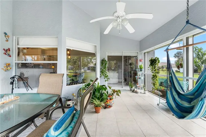 Sunroom featuring ceiling fan and lofted ceiling