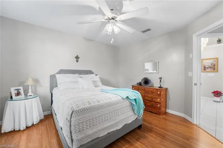 Bedroom featuring hardwood / wood-style flooring and ceiling fan