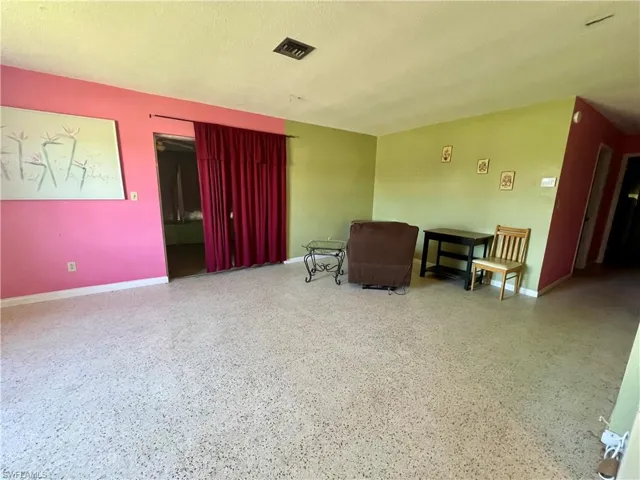 Living room featuring a textured ceiling