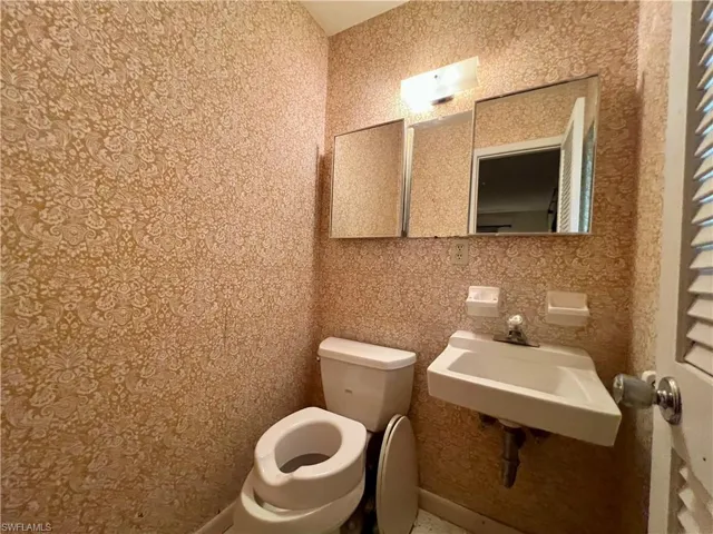 Bathroom featuring sink and toilet