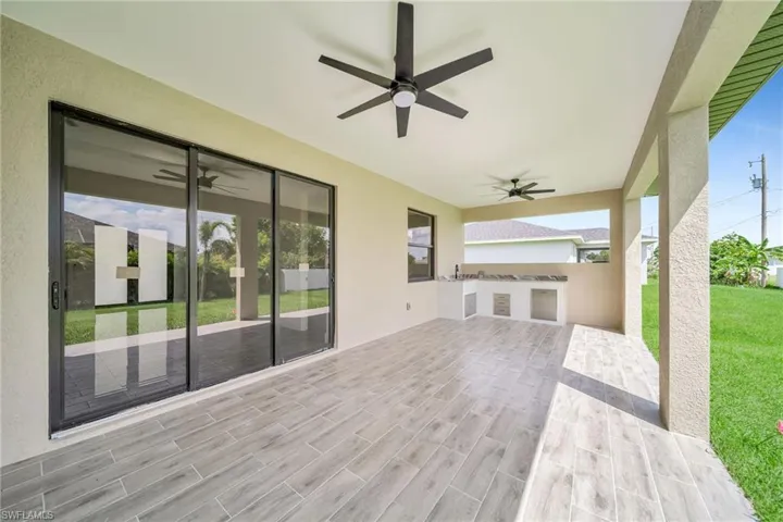 View of patio featuring ceiling fan