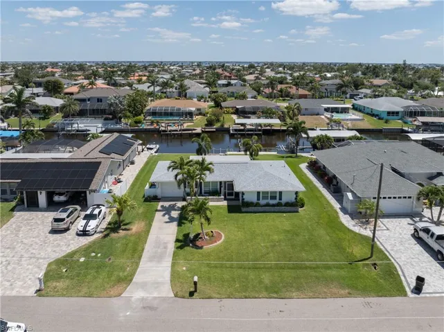 Bird's eye view featuring a water view and a residential view