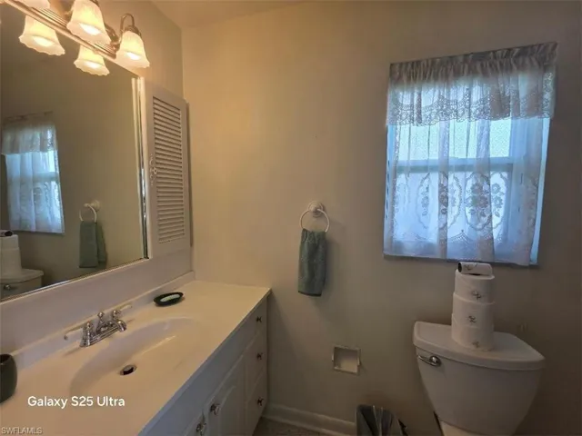 Half bath with toilet and vanity