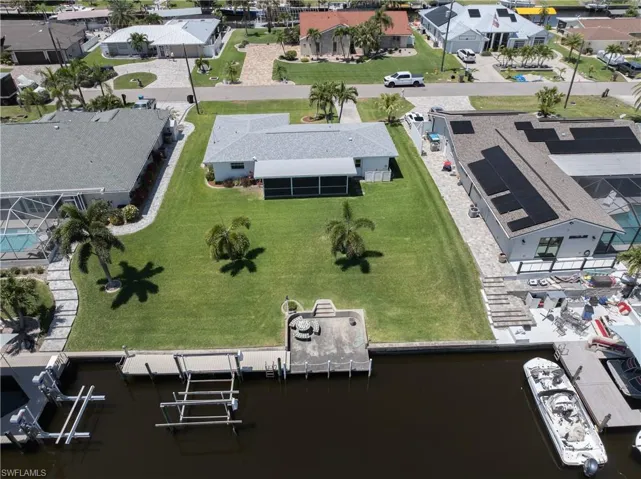 Aerial view featuring a residential view and a water view