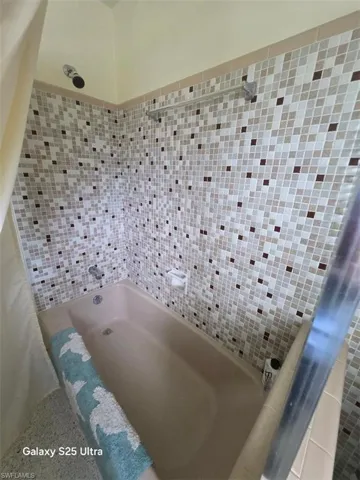 Bathroom featuring a bath and a shower