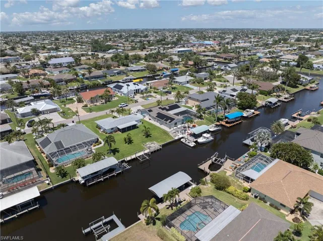 Bird's eye view with a water view and a residential view