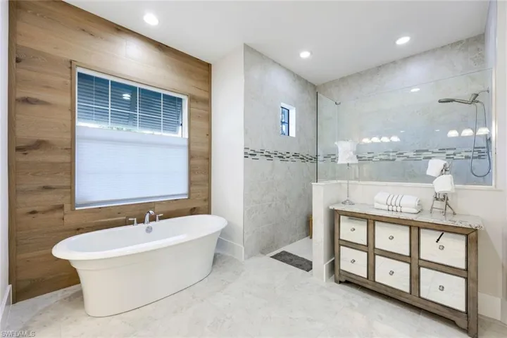 Bathroom featuring independent shower and bath