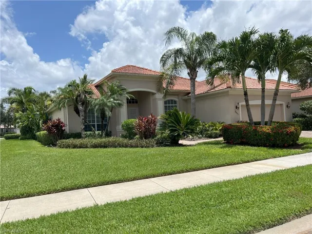 Exterior residence with a stucco finish and a terracotta tile roof