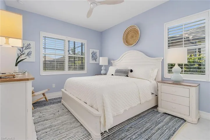Bedroom featuring ceiling fan and light tile patterned flooring