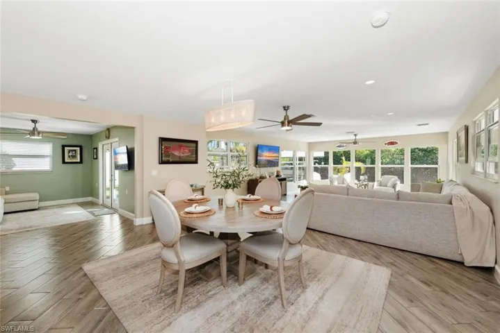 Dining room with ceiling fan and light wood-style flooring