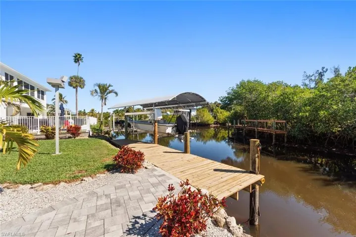 Dock featuring a water view and boat lift