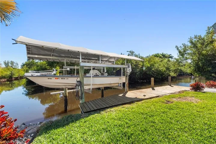 Dock with a water view and boat lift