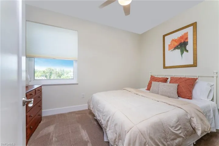 Bedroom featuring carpet flooring and ceiling fan