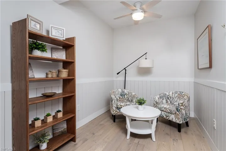 Sitting room featuring light hardwood / wood-style floors and ceiling fan