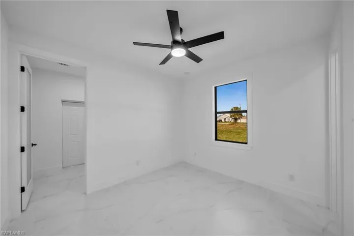 Spare room featuring ceiling fan