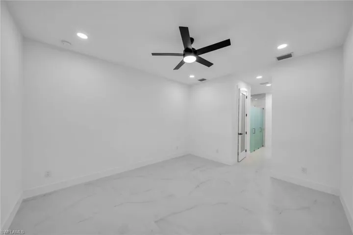 Empty room featuring ceiling fan