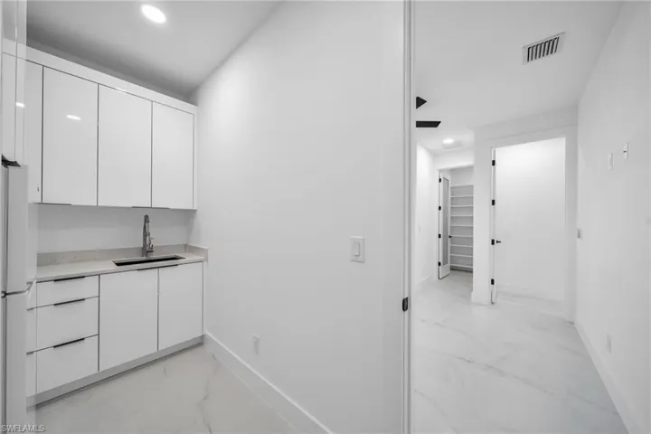 Corridor featuring sink