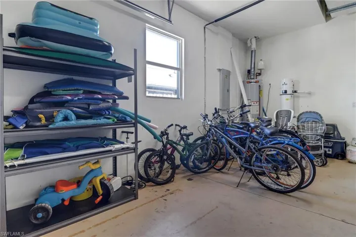 Garage featuring gas water heater