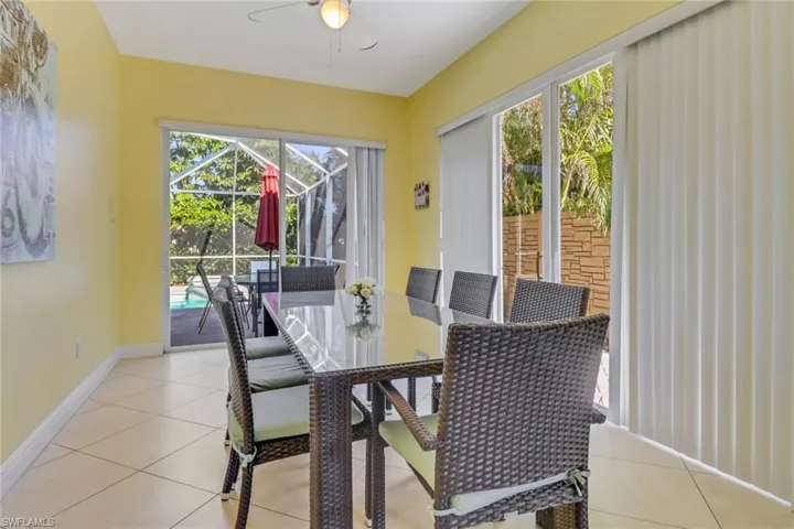 Dining room featuring ceiling fan and light tile patterned flooring
