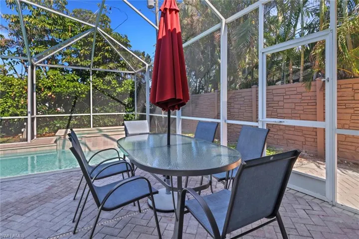 Unfurnished sunroom with a swimming pool