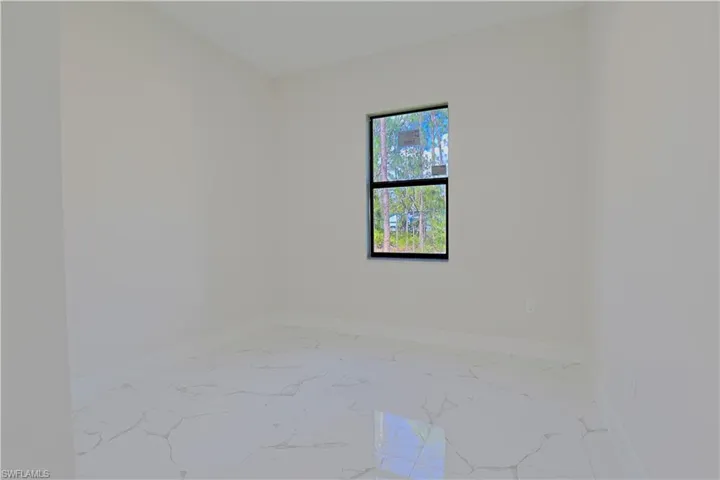 Unfurnished room with marble finish flooring