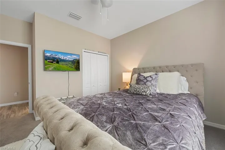 Bedroom with carpet and a closet