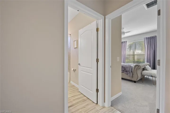 Hallway with light carpet