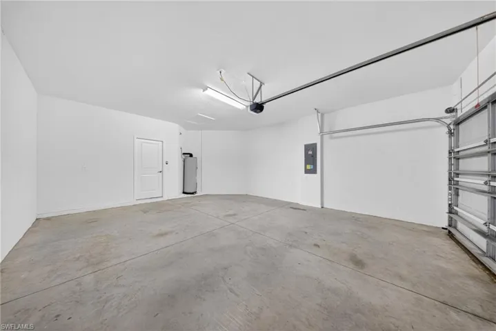 Garage with electric panel and water heater