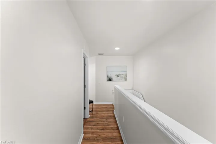 Hall featuring dark hardwood / wood-style flooring