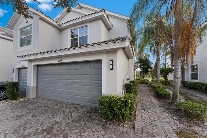 View of side of home with a garage