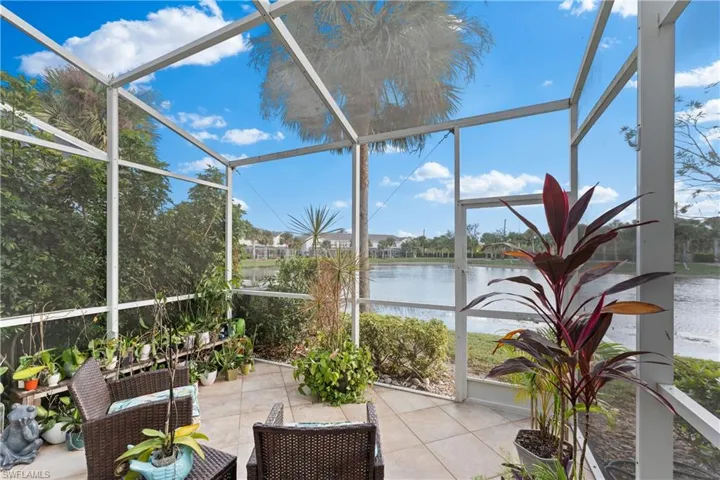 Unfurnished sunroom with a water view