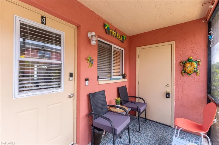 Entrance to property with stucco siding