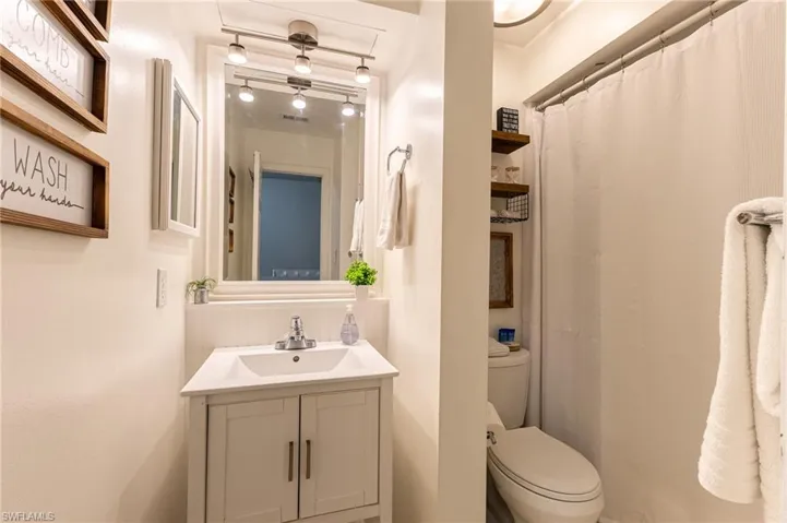 Bathroom featuring vanity and a shower with curtain