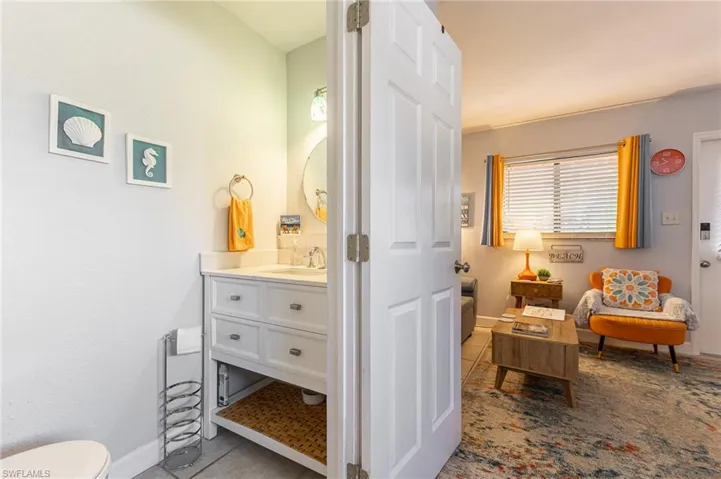 Bathroom featuring light tile patterned floors and vanity