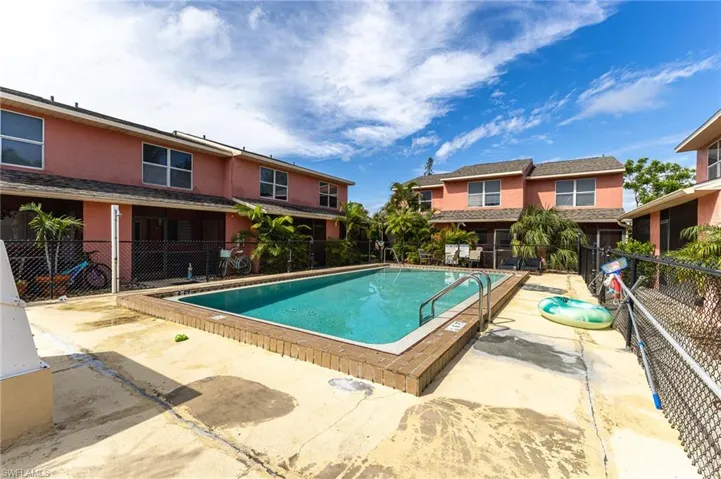 Community pool with a patio