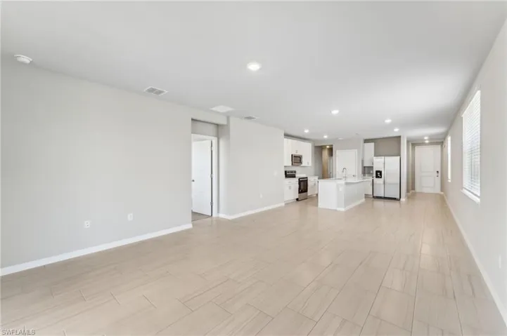 Unfurnished living room with sink
