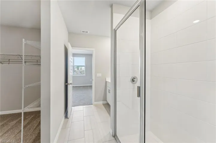 Bathroom with vanity and walk in shower