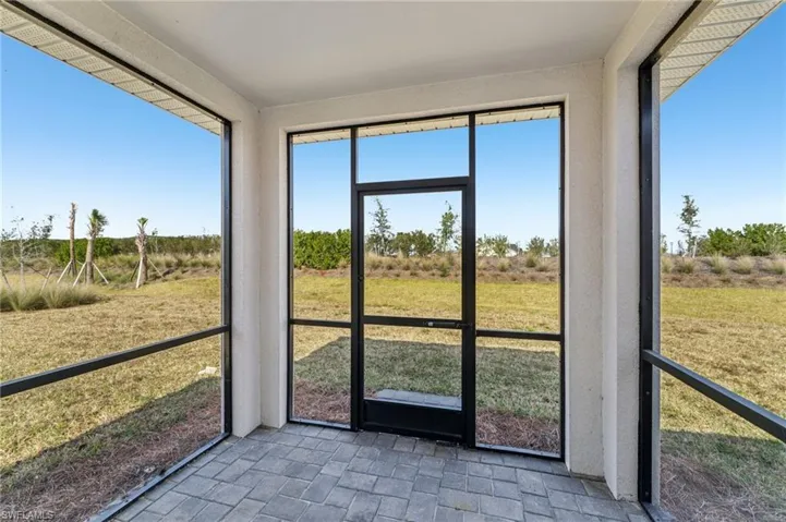Unfurnished sunroom featuring a rural view