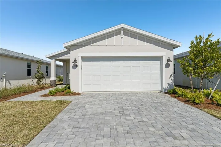 Ranch-style house featuring a garage