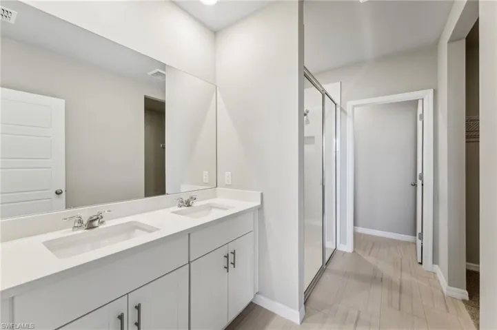 Bathroom with vanity and walk in shower