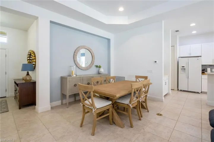 Room featuring light-toned tile flooring and white walls