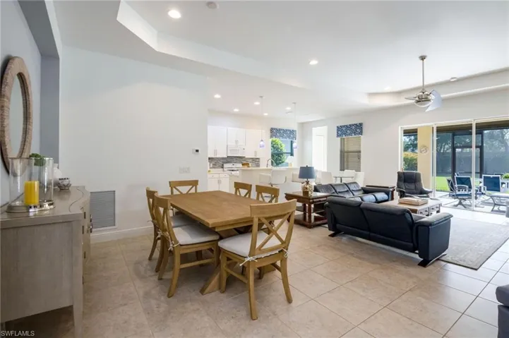 Living area featuring recessed lighting, a ceiling fan, and large tile flooring