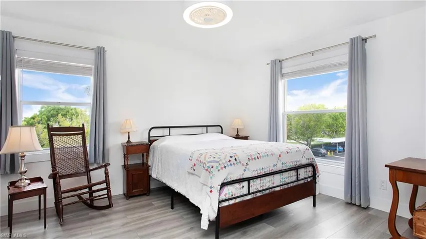 Bedroom featuring light wood-style flooring and multiple windows