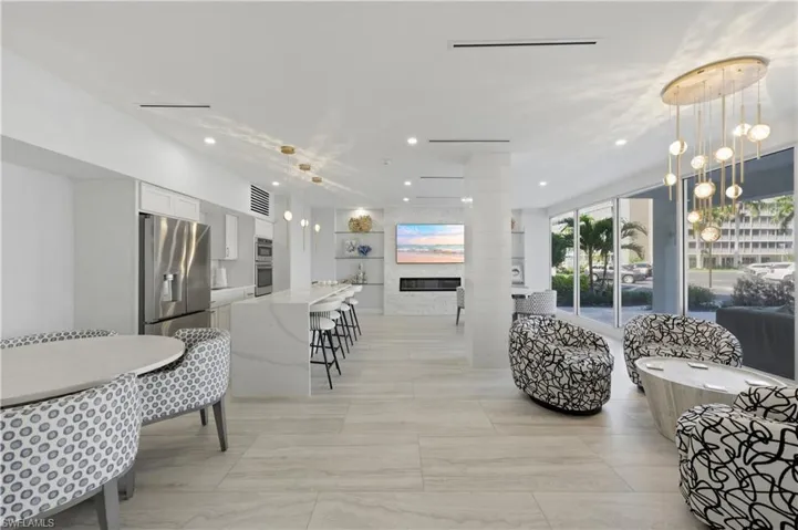 Building Living area featuring recessed lighting and a glass covered fireplace
