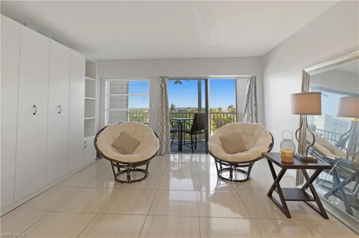 Sitting room featuring light tile patterned floors