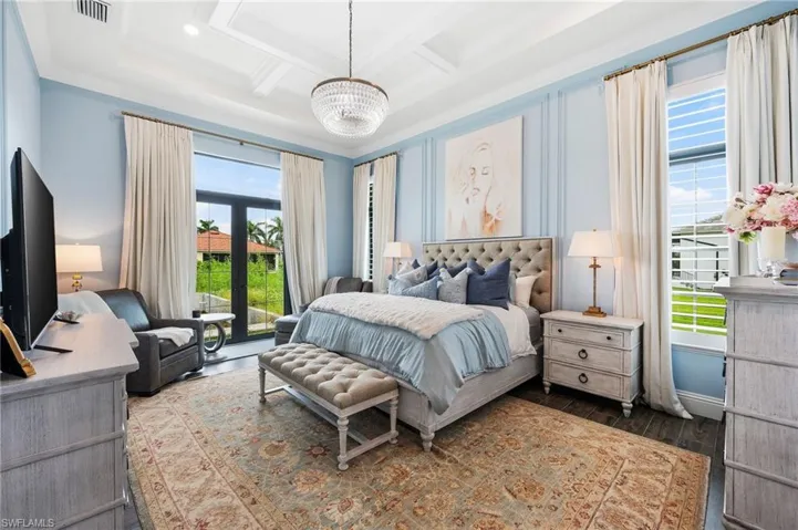 Luxurious 1st flr, Primary Suite w french doors, elegant bath and 2 spacious walk in closets