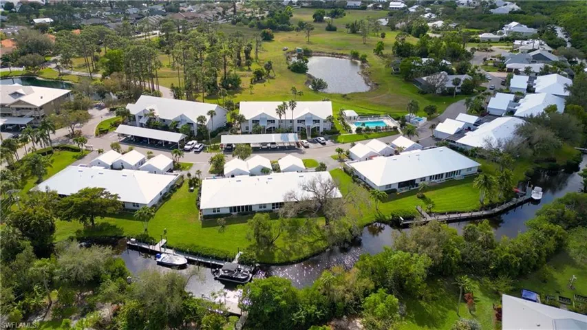 Drone / aerial view featuring waterway and community docks