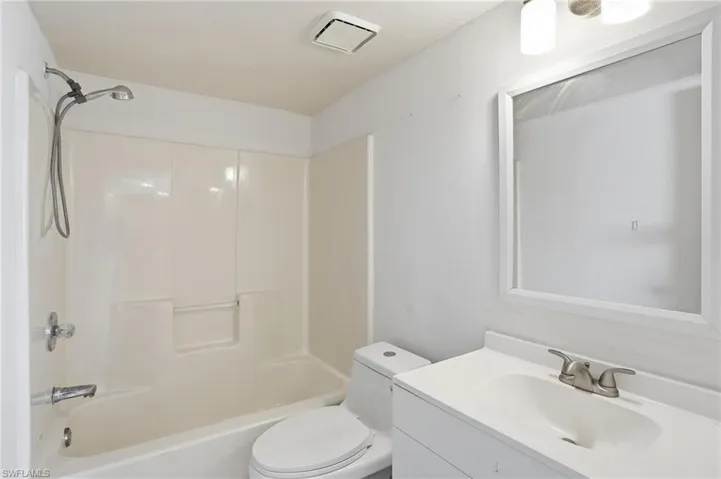 Full bathroom featuring vanity and  shower combination