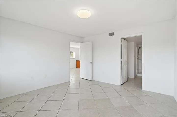 Unfurnished bedroom featuring light tile patterned floors