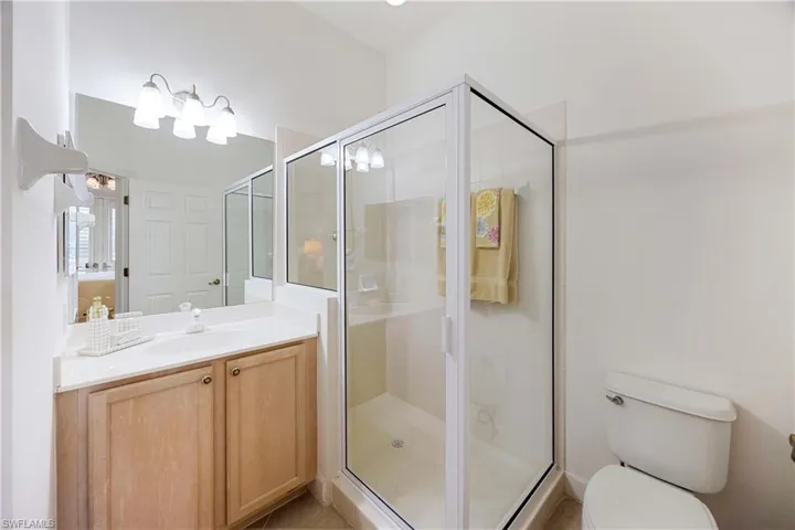 Bathroom with vanity and a shower stall